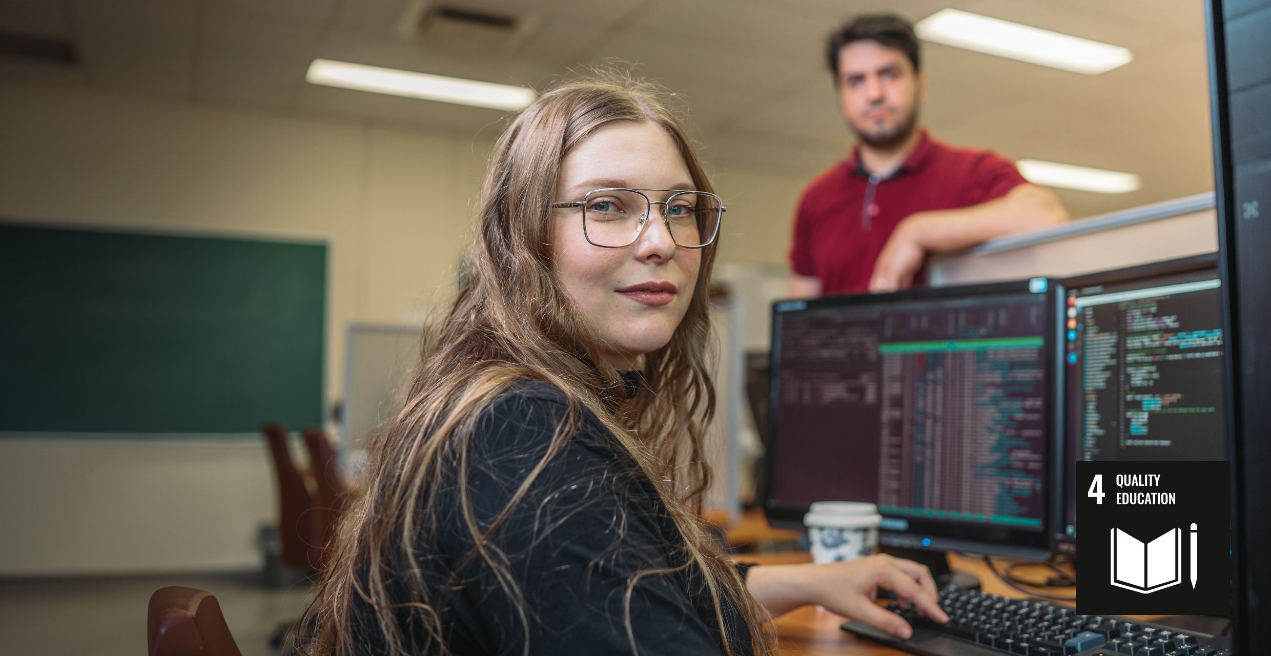 a women in front of a computer